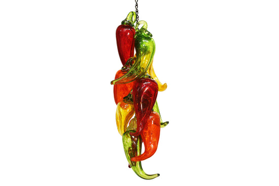 Brad Smith's glass chili peppers hanging together in a group against a white background